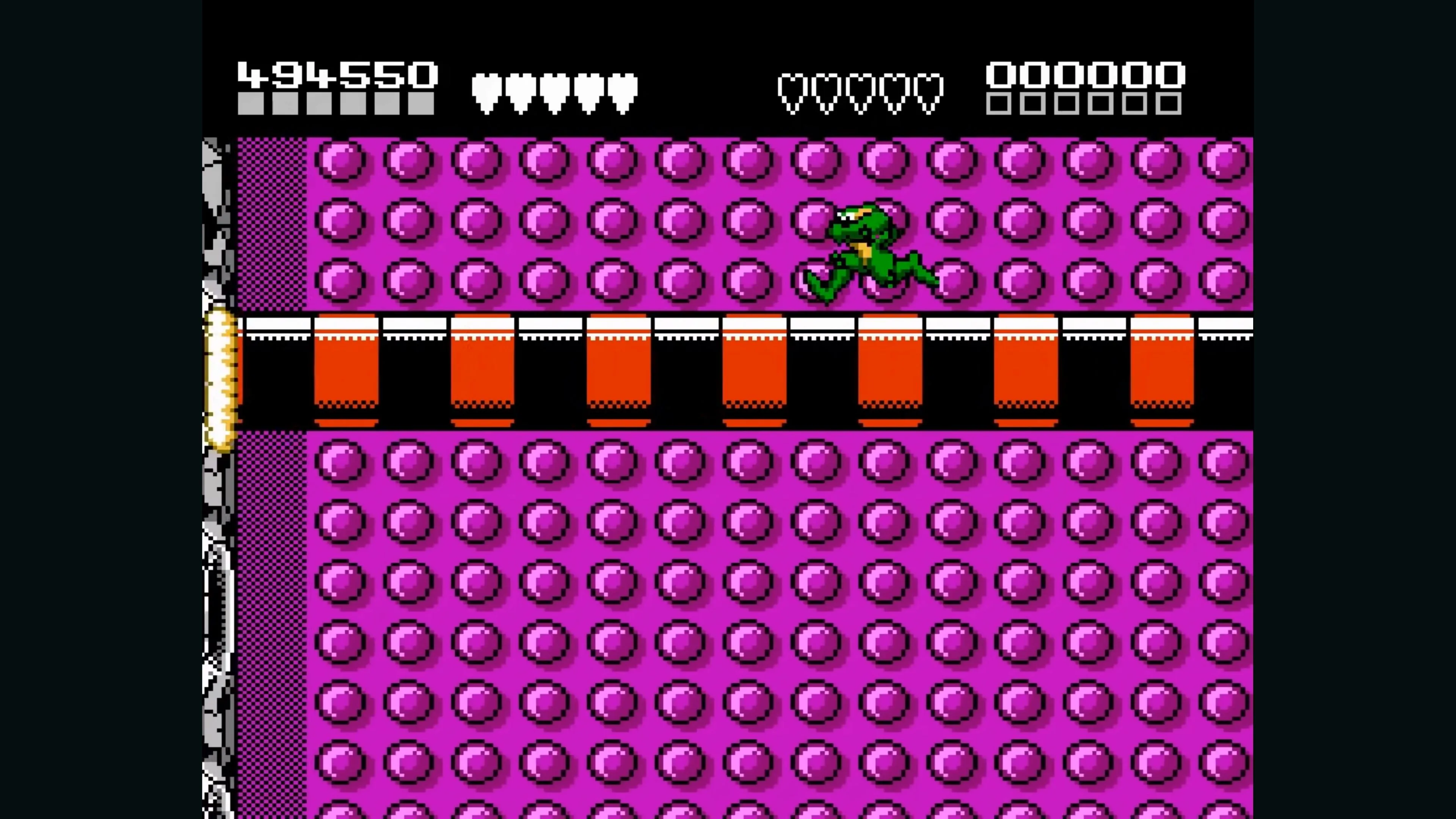Battletoads (1991) trong một pha hành động, nhảy qua các nền tảng và né tránh chướng ngại vật
