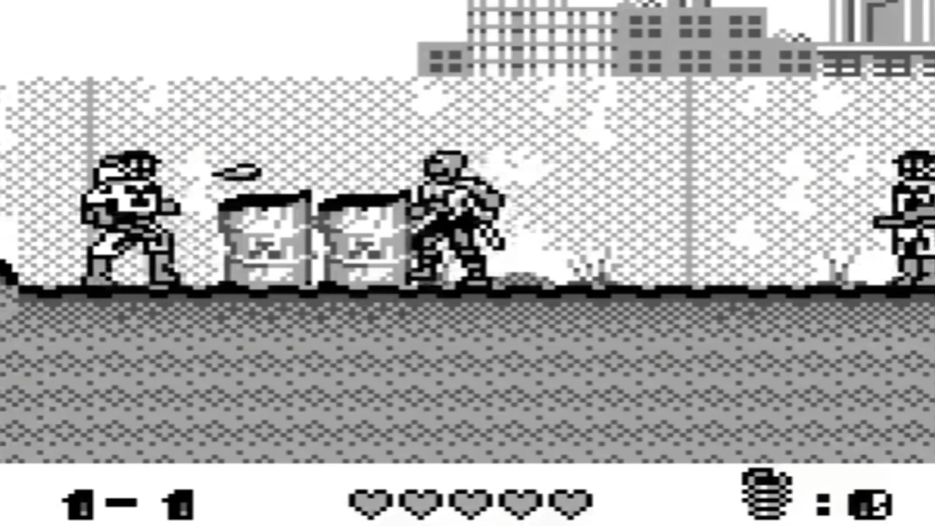 Hình ảnh gameplay từ Toxic Crusaders trên Game Boy, mô tả nhân vật Toxie đang chiến đấu trong môi trường màn hình ngang.