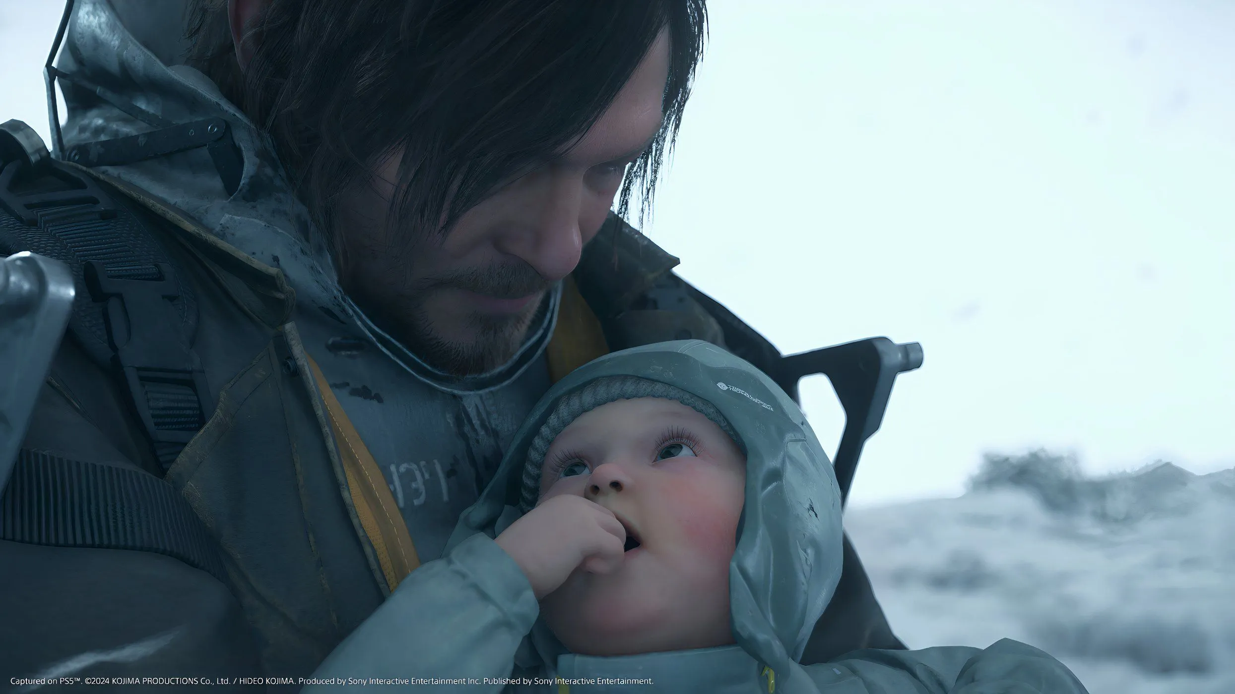 Hình ảnh Sam Porter Bridges và BB từ game Death Stranding 2: On The Beach, trong một cảnh rùng rợn