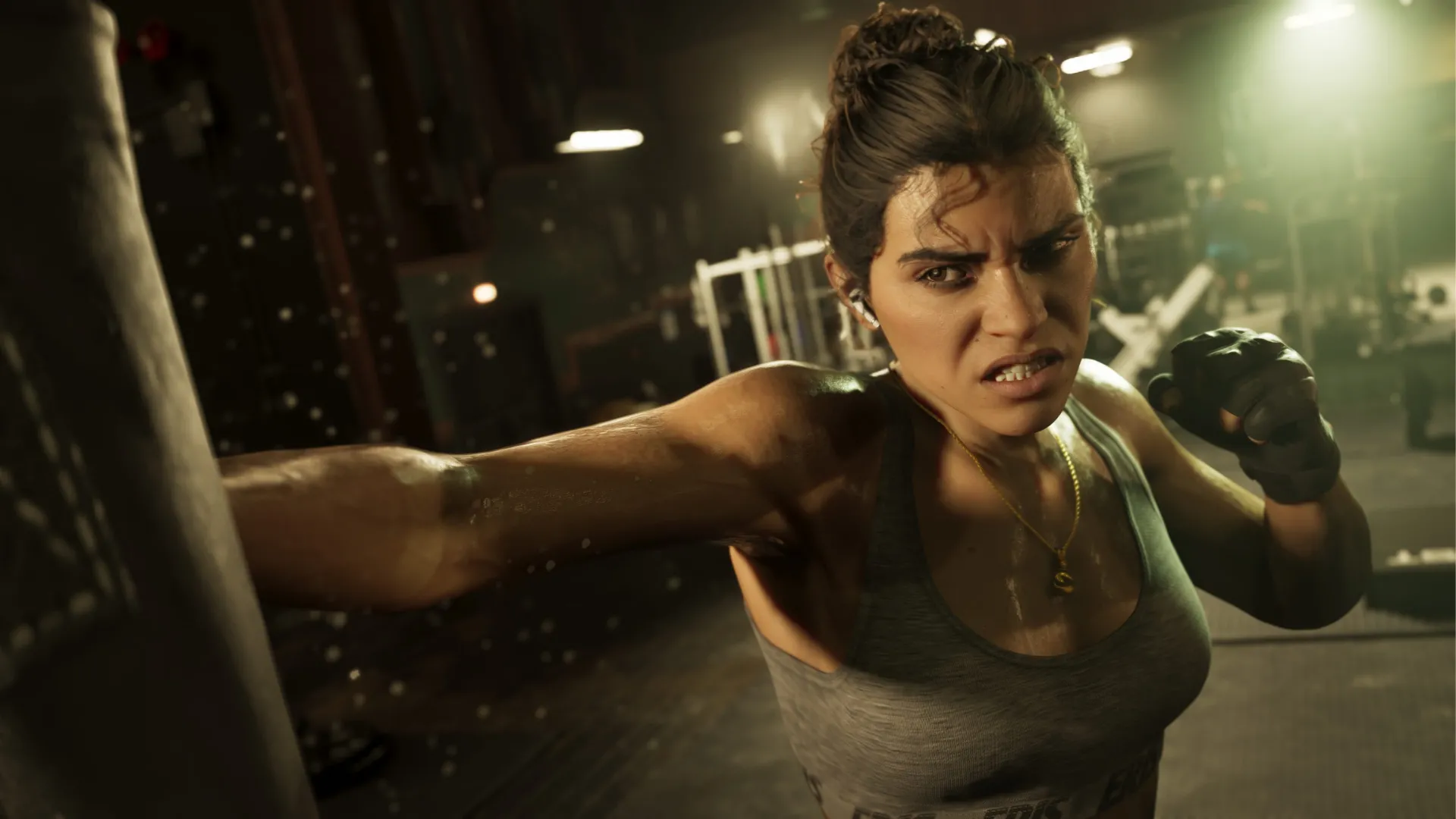 Jason nâng tạ trên bãi biển và Lucia đấm bao cát trong phòng gym trong GTA VI