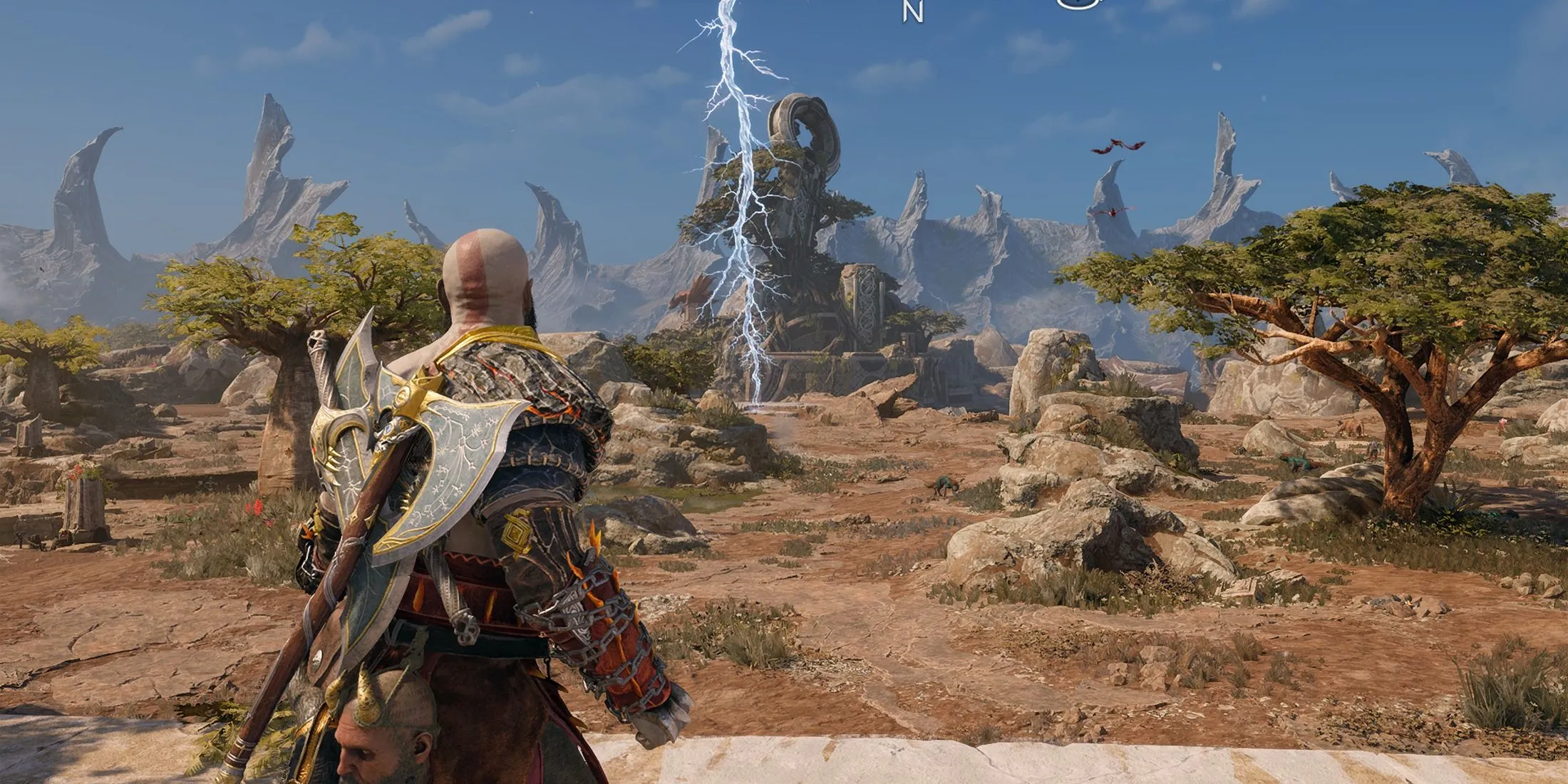 Kratos và Atreus khám phá một khu vực The Crater rộng lớn với cảnh sét đánh trong God of War Ragnarok