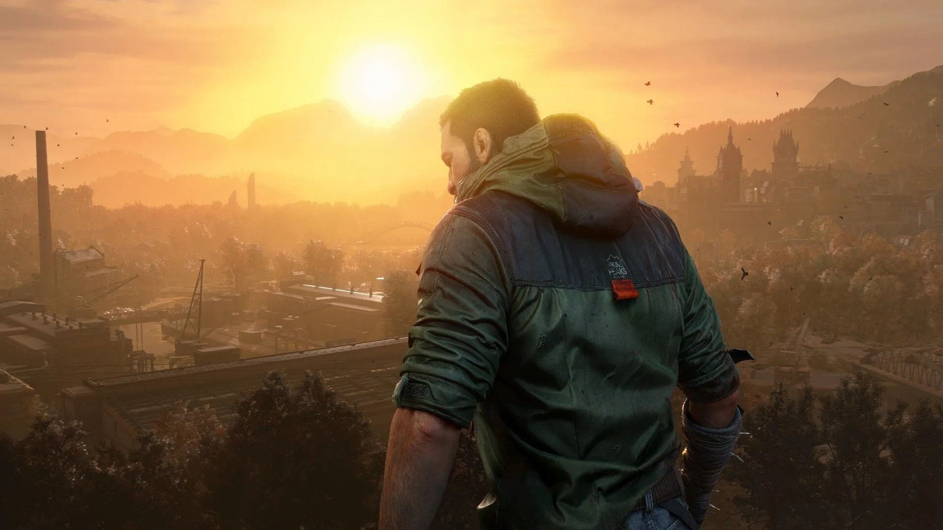 Kyle Crane, nhân vật chính của Dying Light, nhìn xa xăm trên một tòa nhà