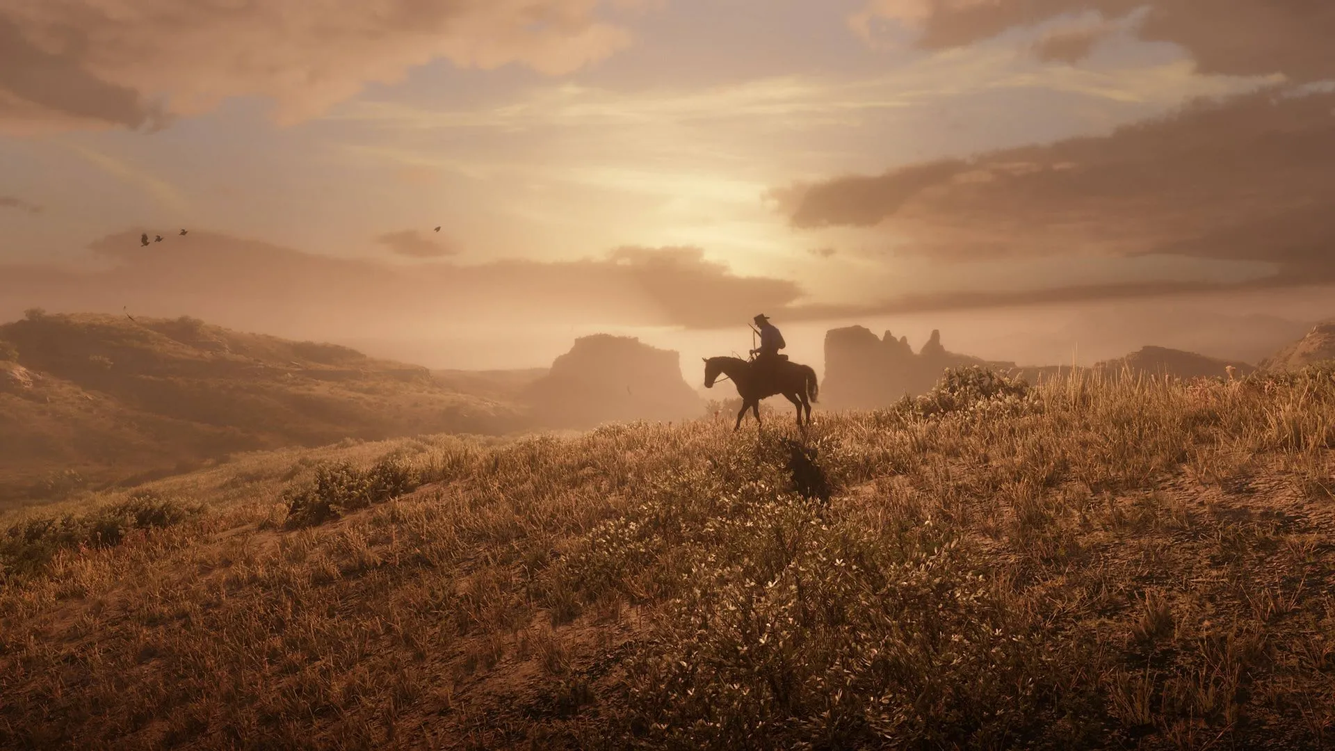Red Dead Redemption 2: Cảnh hoàng hôn hùng vĩ trong thế giới mở của game.